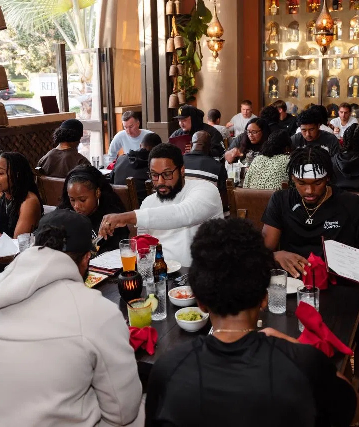 Families and advisors seated together around a table